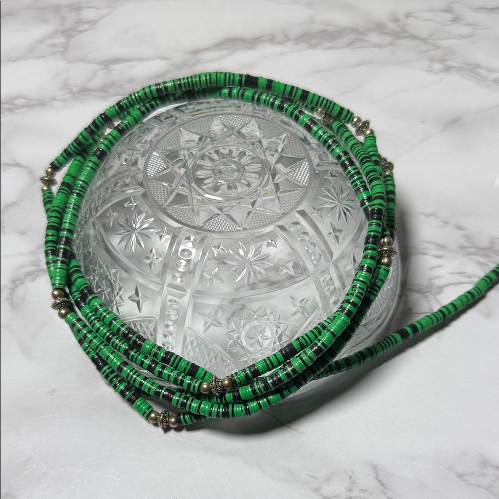 Green and Black African Heishi waist beads with silver bead accents. 60” strands